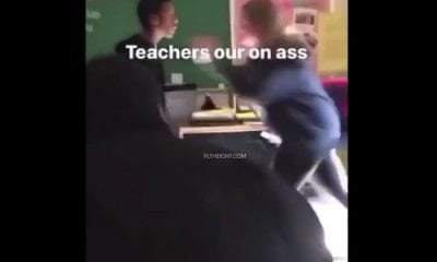 Female teacher fights black teen boy in the classroom
