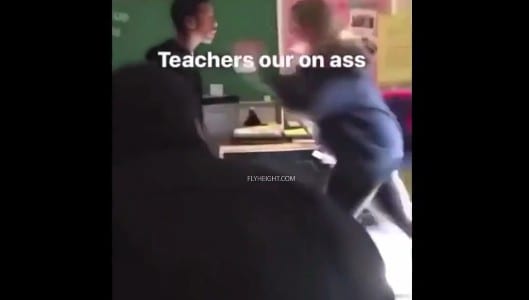 Female teacher fights black teen boy in the classroom 