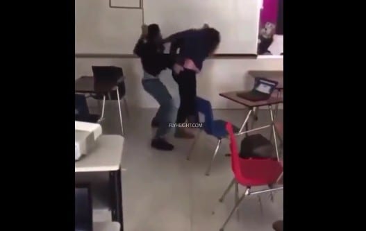 Aggressive female teacher fights black teen boy in classroom 