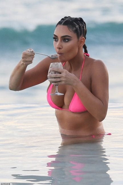 Kim Kardashian's Cat Face At Her Sultry Beach Photoshoot Causes Stir Online