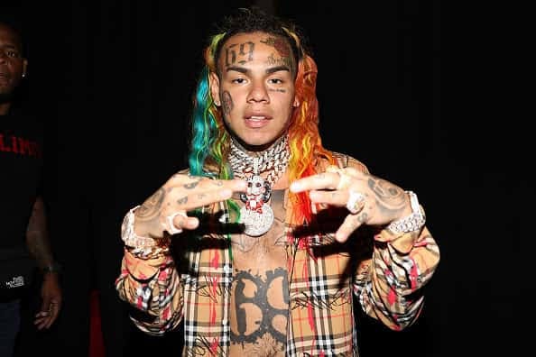 The Streets Doesn't F*ck With Tekashi 6ix9ine, Man Tears Rapper's Album Posters 