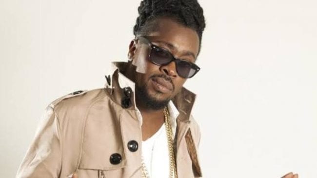 Dancehall Star Beenie Man Faints At Mother's Funeral 