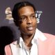 ASAP Rocky Steps On Stage Wearing Rihanna's Clothes - Wig, Skirt & Purse