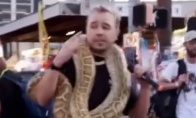 Crypto Rapper Spottie WiFi, Performing Live With A Snake On His Neck In Viral Video