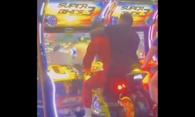 TikToker "Pranks" Man By Getting Behind Him On A Arcade Motorcycle
