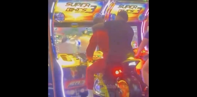 TikToker "Pranks" Man By Getting Behind Him On A Arcade Motorcycle